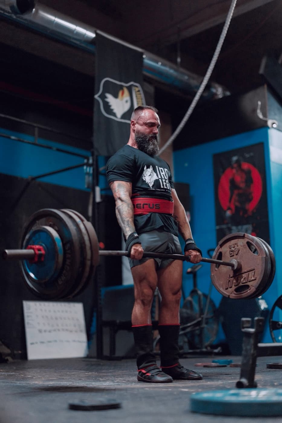 Sean Riley locked out at the top of a heavy deadlift at Iron Legion Strength Club.